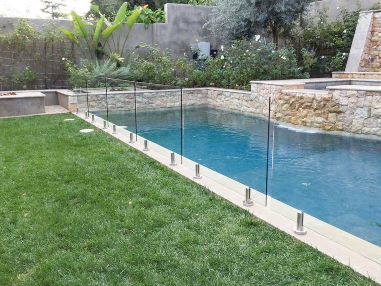 frameless glass pool fence in the backyard of a house in Beverly Hills, CA