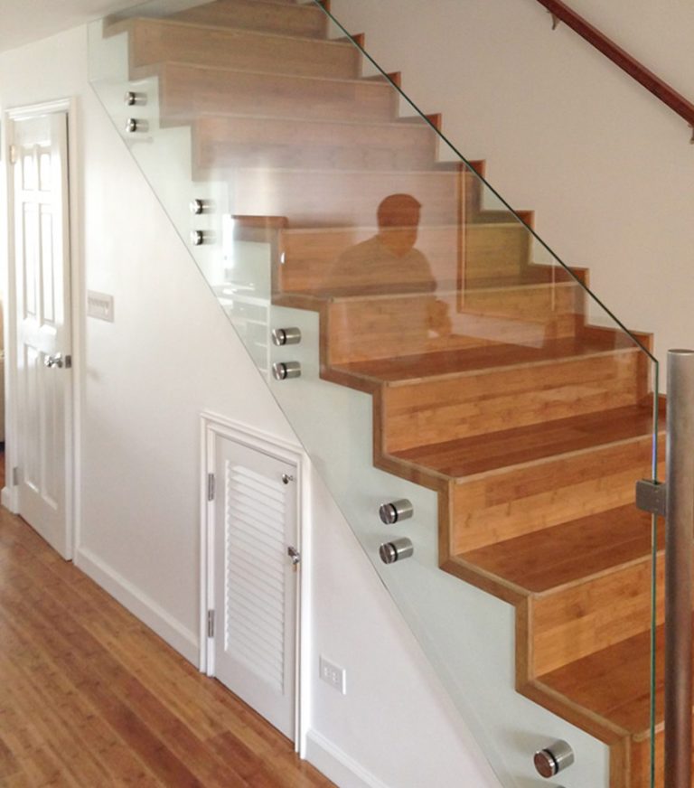 Glass railing for a staircase inside a home in los angeles