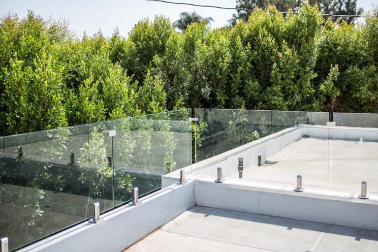 Frameless glass railing on a rooftop deck