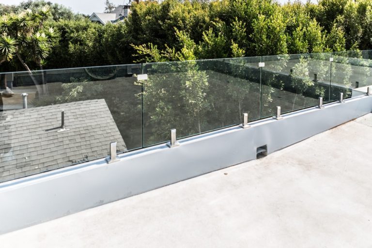 Frameless glass railing on a rooftop deck